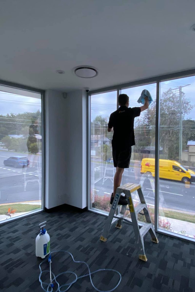 Clear anti-graffiti film protecting Gold Coast retail storefront windows from vandalism and etching damage